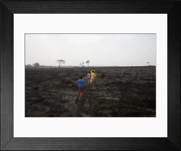 Framed Print : Children walk on a burned area of Chapada dos Guimaraes in midwesten Brazil Framed Print : Children walk on a burned area of Chapada dos Guimaraes in midwesten Brazil