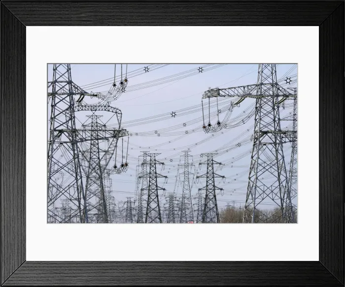 Framed Print : Power lines are seen along a highway on the outskirts of Beijing