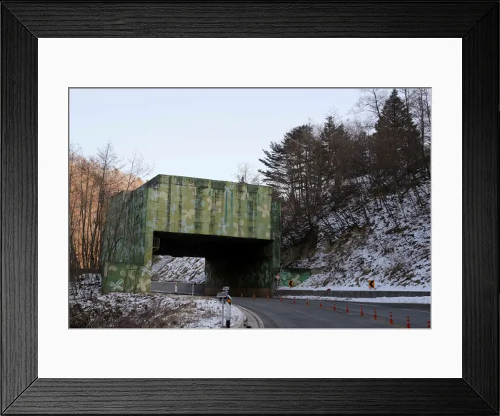 Framed Print : A Cold War era anti-tank barricade is seen on a highway near the border with North Korea Framed Print : A Cold War era anti-tank barricade is seen on a highway near the border with North Korea