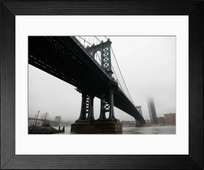 Framed Print : The Manhattan skyline is seen partially in fog from beneath the Manhattan bridge in Framed Print : The Manhattan skyline is seen partially in fog from beneath the Manhattan bridge in