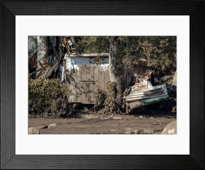 Framed Print : Damaged property pushed into a tree after a mudslide in Montecito, California
