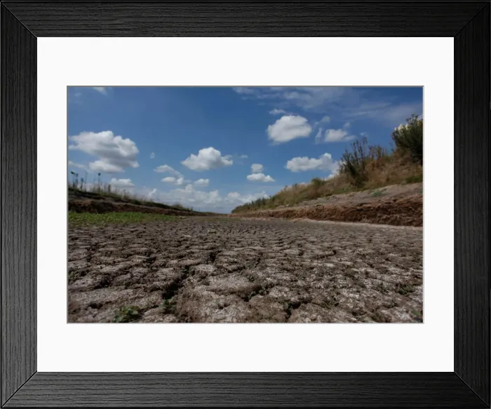 Framed Print : A dried-up creek bed is seen in a drought-affected area near Chivilcoy