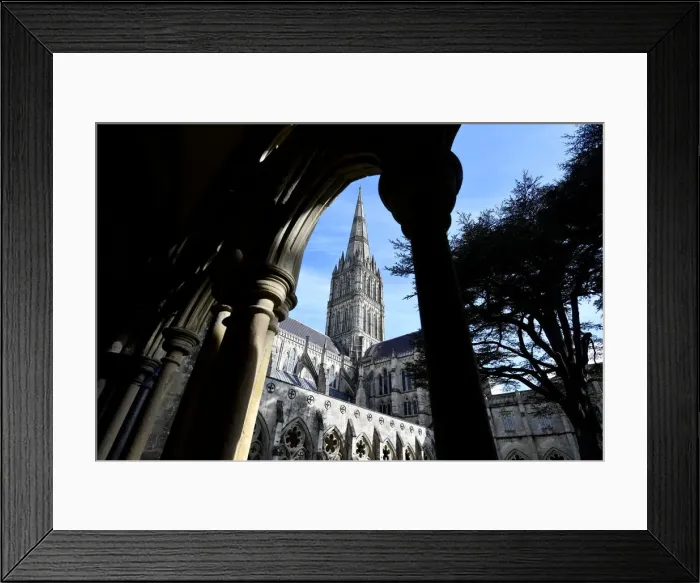 Framed Print : Salisbury Cathedral is seen through the arches of its cloisters