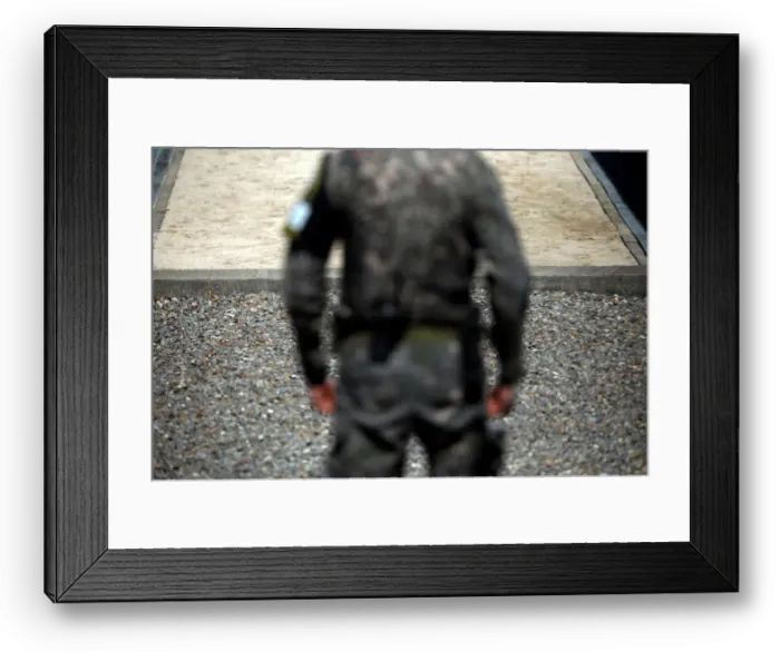 Framed Print : A South Korean soldier stands guard near the concrete borderline at the truce village of Framed Print : A South Korean soldier stands guard near the concrete borderline at the truce village of