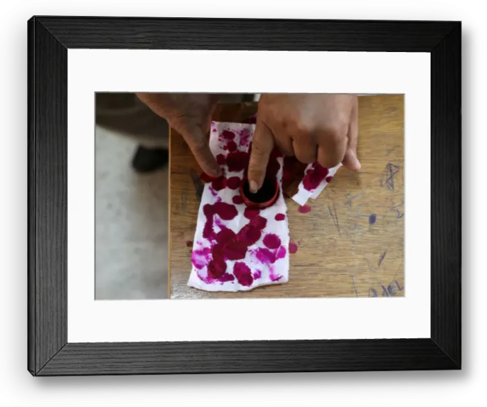 Framed Print : A voters finger is marked with ink at a polling station during the presidential Framed Print : A voters finger is marked with ink at a polling station during the presidential