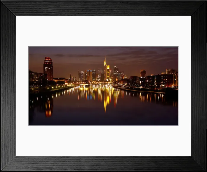 Framed Print : The Frankfurt skyline with its financial district is photographed on early evening in Framed Print : The Frankfurt skyline with its financial district is photographed on early evening in
