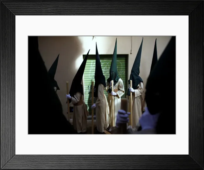 Framed Print : Penitents take part in the Lagrimas and Favores brotherhood
