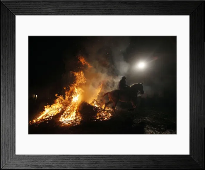 Framed Print : A man rides his horse through flames during the annual Saint Anthony purification Framed Print : A man rides his horse through flames during the annual Saint Anthony purification