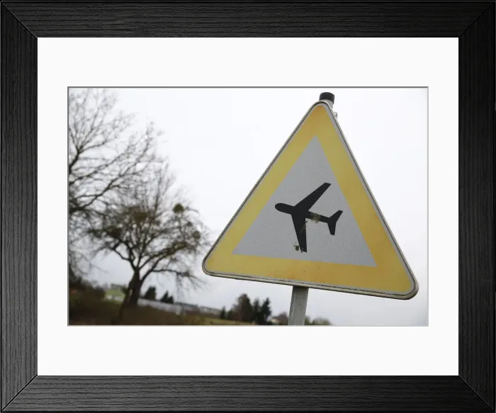 Framed Print : A traffic sign warning of low flying aircraft stands near to LSC Westerwald flight club Framed Print : A traffic sign warning of low flying aircraft stands near to LSC Westerwald flight club
