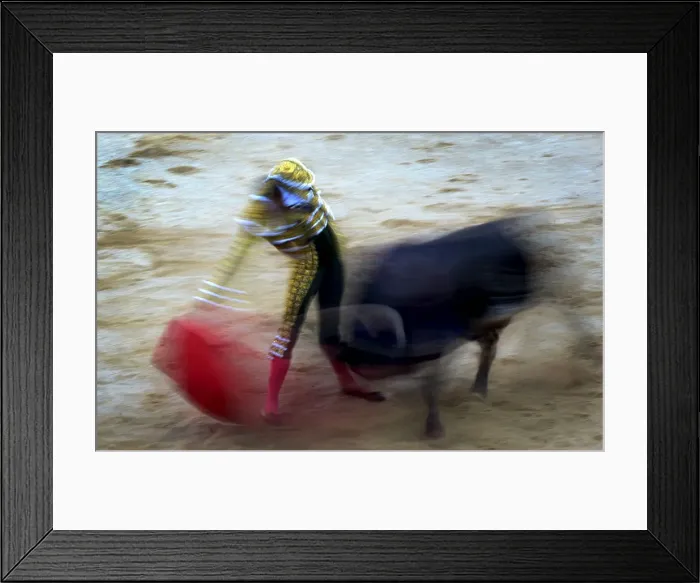 Framed Print : Spanish bullfighter Pepe Moral performs a pass during a bullfight at the San Fermin Framed Print : Spanish bullfighter Pepe Moral performs a pass during a bullfight at the San Fermin