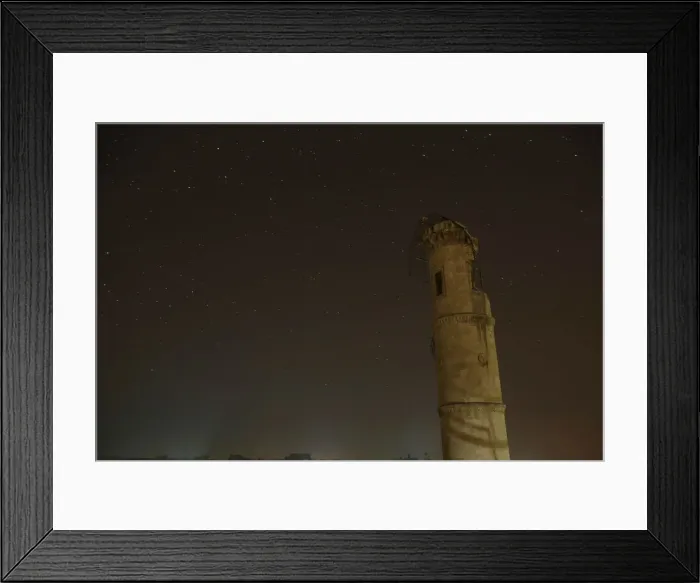 Framed Print : A damaged minaret is pictured at night in Aleppo, Syria Framed Print : A damaged minaret is pictured at night in Aleppo, Syria