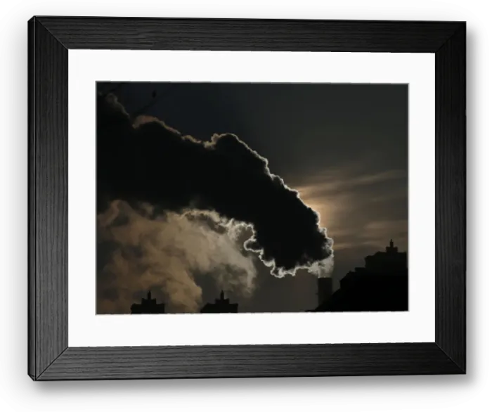 Framed Print : Smoke from a chimney is silhouetted against the rising sun in the northern city of Harbin Framed Print : Smoke from a chimney is silhouetted against the rising sun in the northern city of Harbin