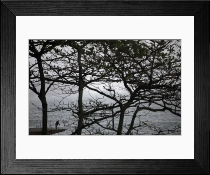 Framed Print : A fisherman checks his equipment in Sao Conrado, Rio de Janeiro Framed Print : A fisherman checks his equipment in Sao Conrado, Rio de Janeiro