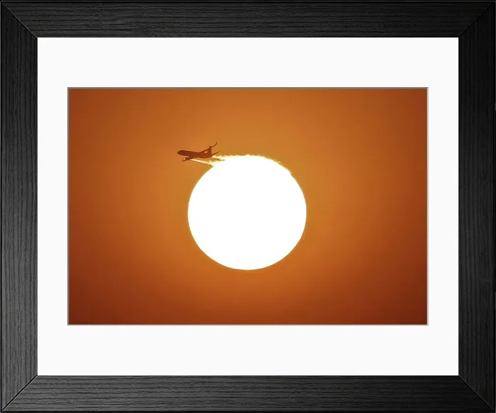Framed Print : An aircraft files near the setting sun in New Delhi Framed Print : An aircraft files near the setting sun in New Delhi
