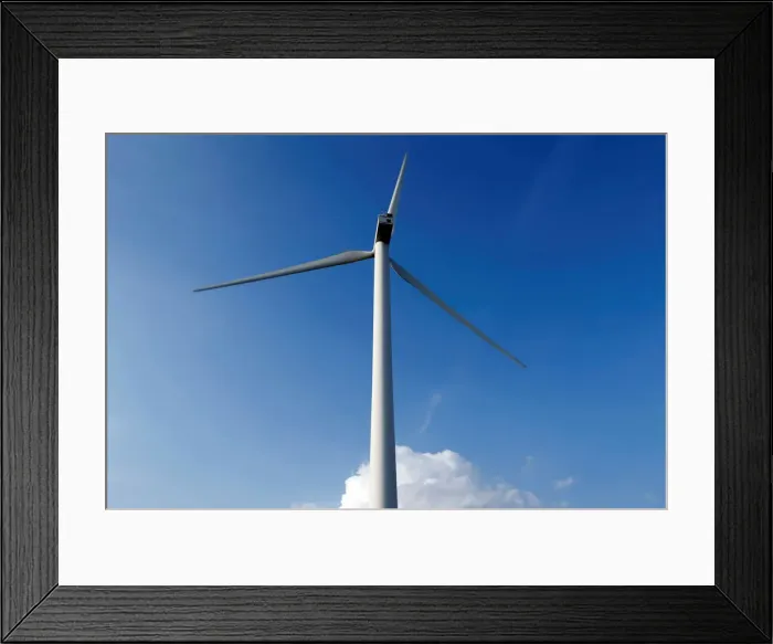 Framed Print : A power-generating wind turbine is seen near the city of Mouchamps Framed Print : A power-generating wind turbine is seen near the city of Mouchamps