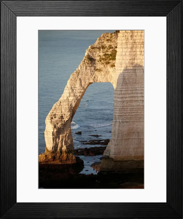 Framed Print : The Porte d Aval, a famous arch of the Etretats cliffs, is seen during sunset Framed Print : The Porte d Aval, a famous arch of the Etretats cliffs, is seen during sunset