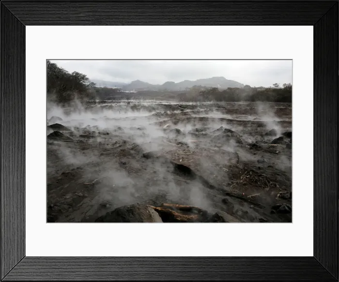 Framed Print : A general view shows an area affected by the eruption of the Fuego volcano in San Miguel