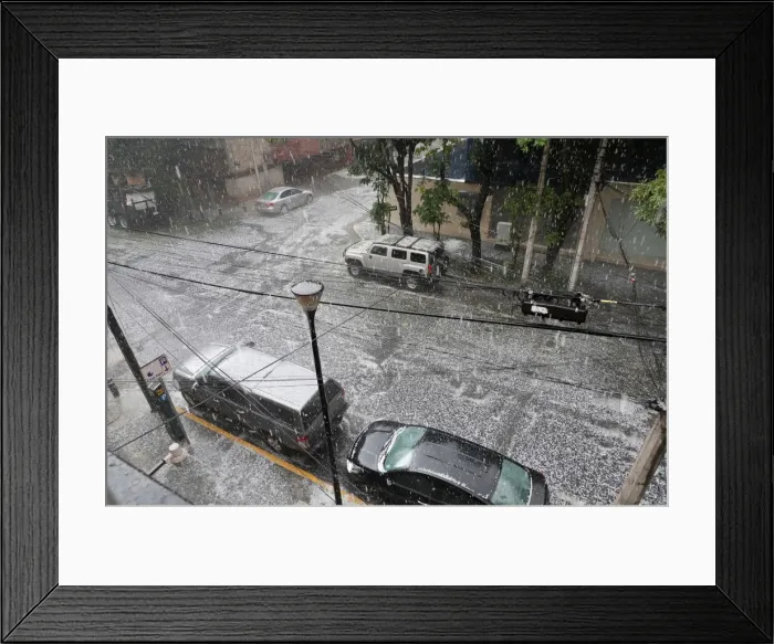 Framed Print : Hail falls on a street during rain in Mexico City Framed Print : Hail falls on a street during rain in Mexico City