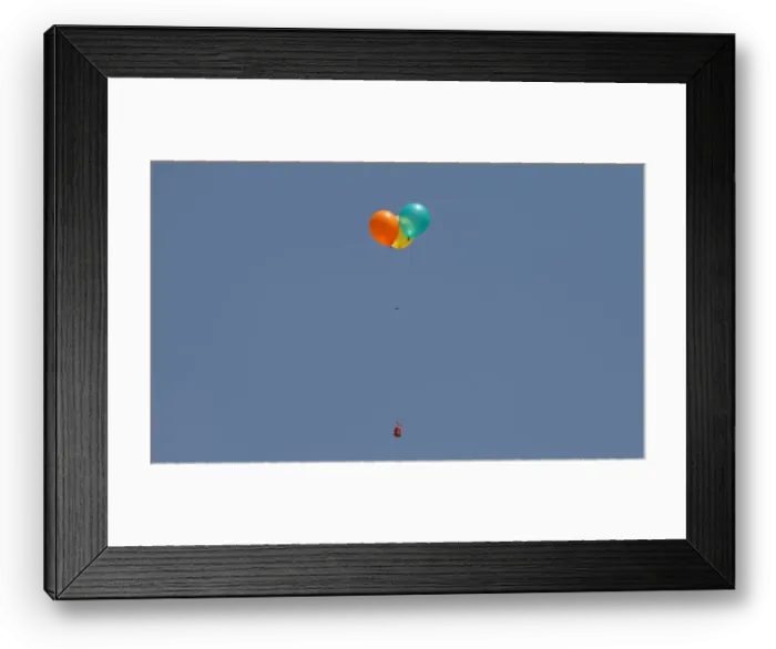 Framed Print : Flaming balloons are released by Palestinian demonstrators to the Israeli side during a Framed Print : Flaming balloons are released by Palestinian demonstrators to the Israeli side during a