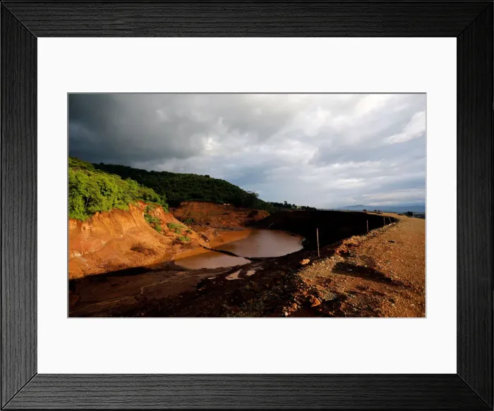 Framed Print : A general view shows the dam that burst its walls, overrunning nearby homes Framed Print : A general view shows the dam that burst its walls, overrunning nearby homes