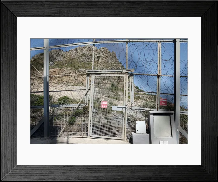 Framed Print : The border fence separating Spains northern enclave Ceuta and Morocco is seen from Ceuta Framed Print : The border fence separating Spains northern enclave Ceuta and Morocco is seen from Ceuta