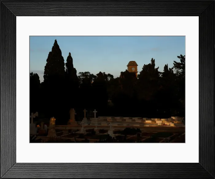 Framed Print : The Saint Patricks Barracks clock tower is seen from the Pembroke Military Cemetery in Framed Print : The Saint Patricks Barracks clock tower is seen from the Pembroke Military Cemetery in