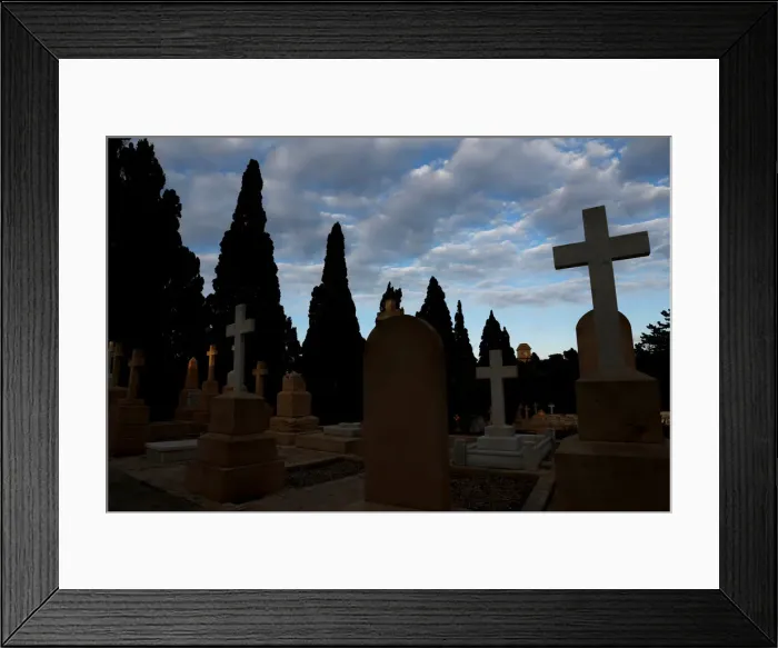 Framed Print : The Saint Patricks Barracks clock tower is seen from the Pembroke Military Cemetery in
