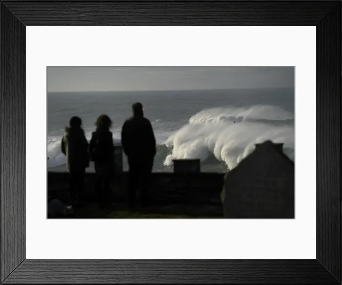 Framed Print : People look at waves as they crash against a lighthouse in the port town of Tapia de Framed Print : People look at waves as they crash against a lighthouse in the port town of Tapia de