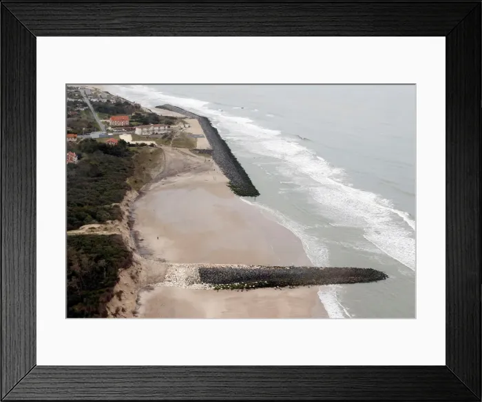 Framed Print : An aerial view shows sea walls on the beach that protect sand dunes from erosion along Framed Print : An aerial view shows sea walls on the beach that protect sand dunes from erosion along