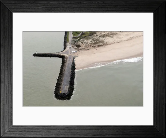 Framed Print : An aerial view shows sea walls on the beach that protect sand dunes from erosion along