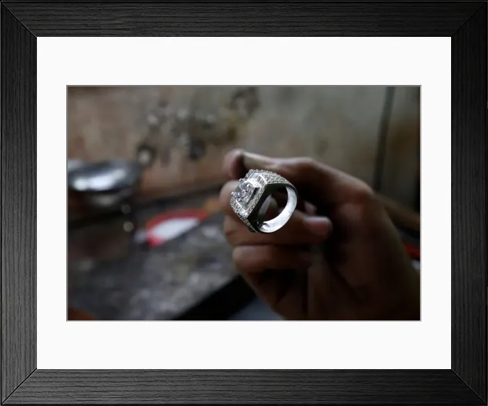 Framed Print : A man works on a silver ring at a workshop in Hanoi Framed Print : A man works on a silver ring at a workshop in Hanoi