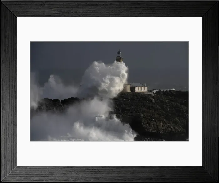 Framed Print : Waves crash on the lighthouse of La Isla del Mouro in the port town of Santander in Framed Print : Waves crash on the lighthouse of La Isla del Mouro in the port town of Santander in