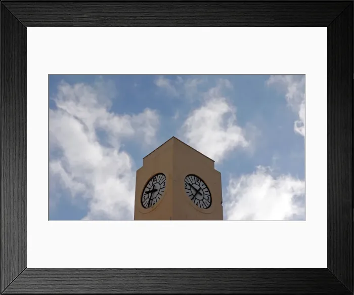 Framed Print : A seagull flies past a broken tower clock which does not indicate the correct time in