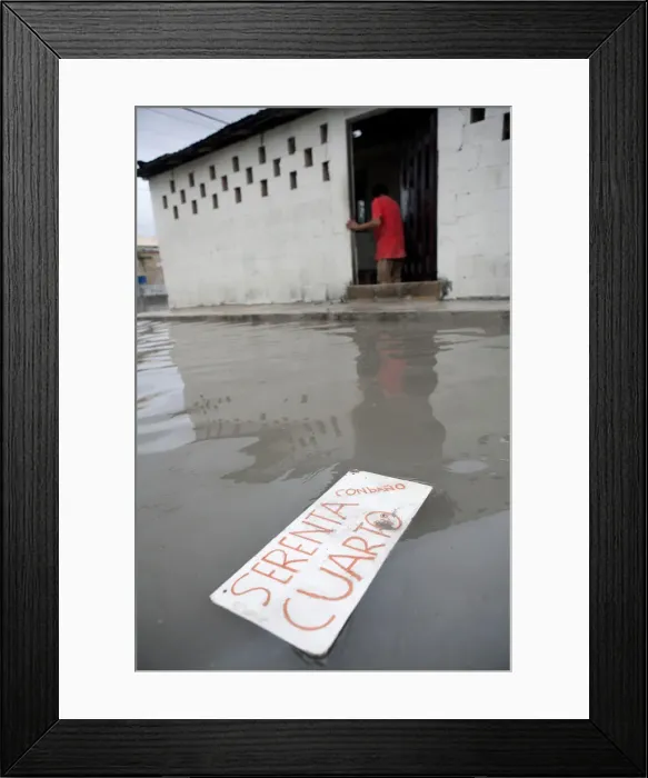 Framed Print : A sign reading Room for Rent floats in a flooded street after heavy rains in Cancun Framed Print : A sign reading Room for Rent floats in a flooded street after heavy rains in Cancun