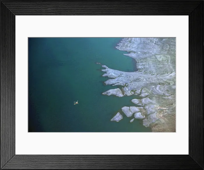 Framed Print : A sightseeing helicopter flies over Lake Mead on the outskirts of Boulder City Framed Print : A sightseeing helicopter flies over Lake Mead on the outskirts of Boulder City