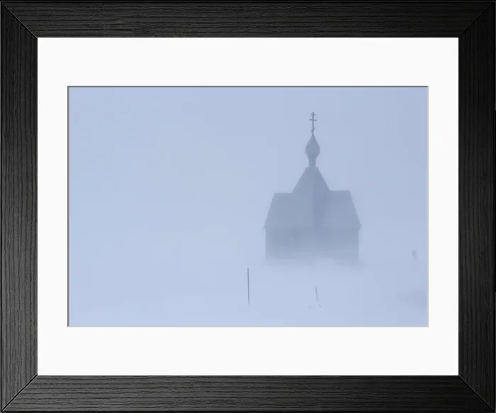 Framed Print : A view shows a church during a heavy snowfall in a settlement on the Pechora Sea island Framed Print : A view shows a church during a heavy snowfall in a settlement on the Pechora Sea island