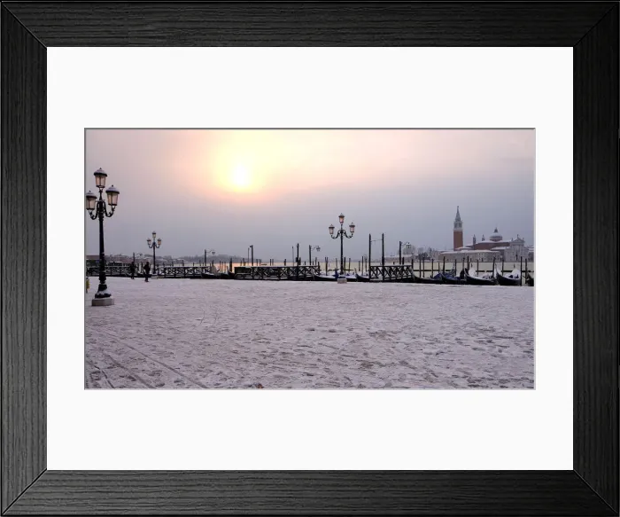 Framed Print : Snow covered gondolas are seen near St. Marks square in Venice lagoon Framed Print : Snow covered gondolas are seen near St. Marks square in Venice lagoon