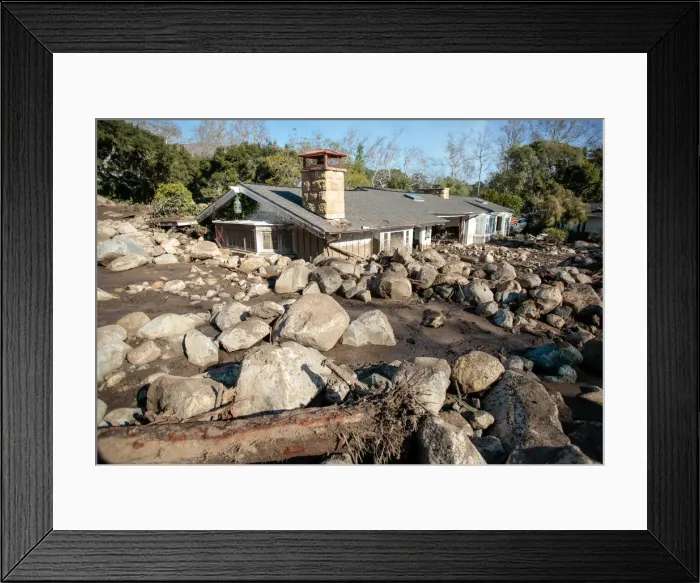 Framed Print : Boulders surround a mud-filled property after a mudslide in Montecito, California Framed Print : Boulders surround a mud-filled property after a mudslide in Montecito, California