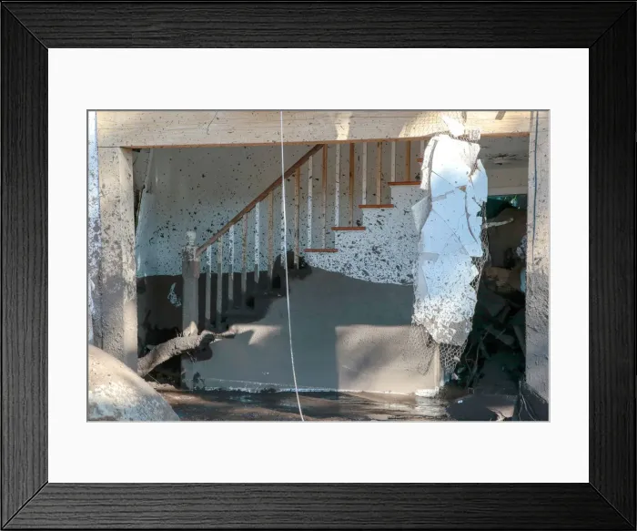Framed Print : A destroyed house is seen after a mudslide in Montecito