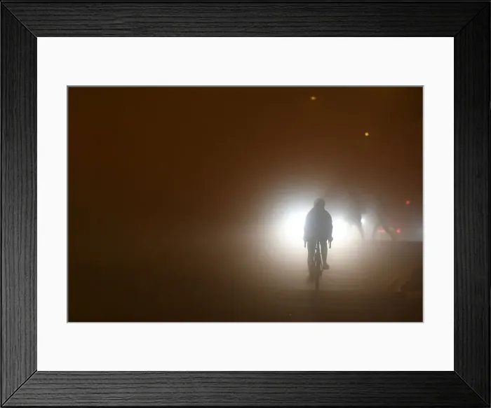 Framed Print : A person cycles through heavy fog in Dublin Framed Print : A person cycles through heavy fog in Dublin