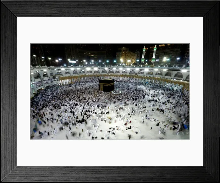 Framed Print : Muslims pray and gather around the holy Kaaba at the Grand Mosque during the holy fasting Framed Print : Muslims pray and gather around the holy Kaaba at the Grand Mosque during the holy fasting