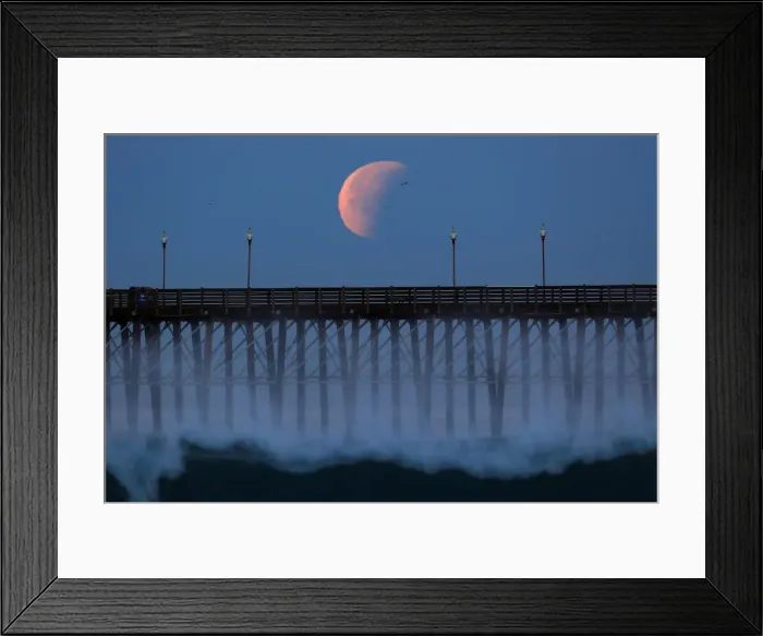 Framed Print : A Blue Moon comes out of a lunar eclipse as it sets past an ocean pier in Oceanside Framed Print : A Blue Moon comes out of a lunar eclipse as it sets past an ocean pier in Oceanside