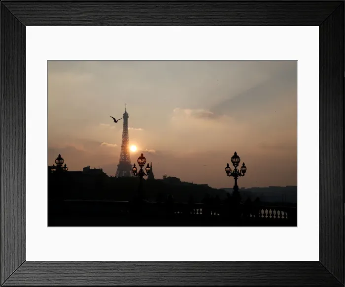 Framed Print : The Eiffel tower is pictured as the sun sets on a winter day in Paris Framed Print : The Eiffel tower is pictured as the sun sets on a winter day in Paris