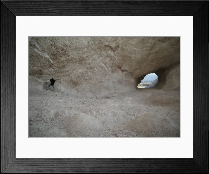 Framed Print : A man uses a pick to break rocks and get sand in a sand mine on the outskirts of Fond Framed Print : A man uses a pick to break rocks and get sand in a sand mine on the outskirts of Fond