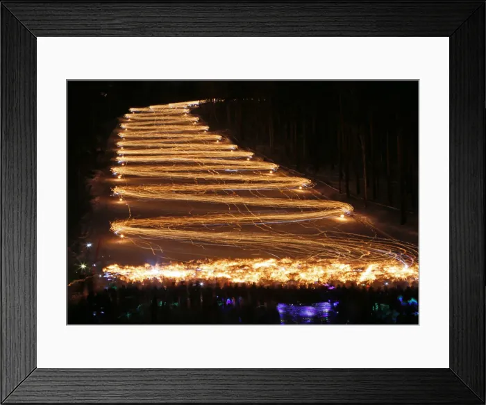 Framed Print : Skiers and snowboarders descend from a slope during an annual festival in Zheleznogorsk Framed Print : Skiers and snowboarders descend from a slope during an annual festival in Zheleznogorsk