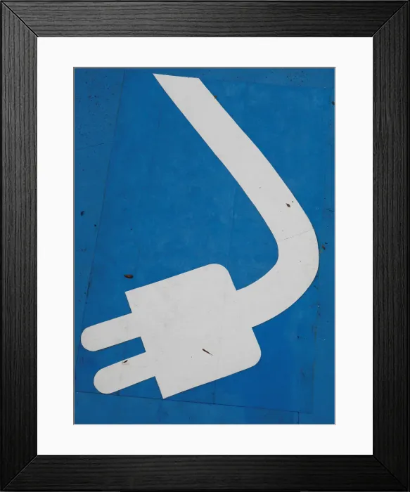 Framed Print : Electric car charging sign is seen in a car park at a petrol station in Sao Paulo Framed Print : Electric car charging sign is seen in a car park at a petrol station in Sao Paulo