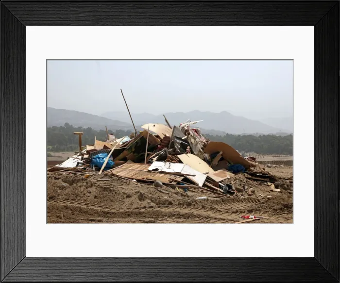 Framed Print : Debris of huts are seen after police evict squatters from a land in Villa El Salvador Framed Print : Debris of huts are seen after police evict squatters from a land in Villa El Salvador