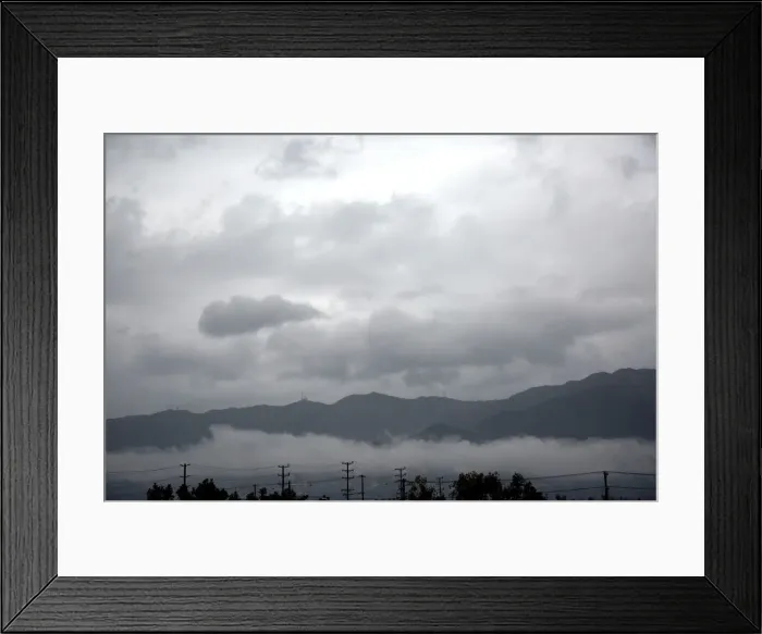 Framed Print : The area of the La Tuna Fire, is preparing for possible mudslides caused by rain on hills