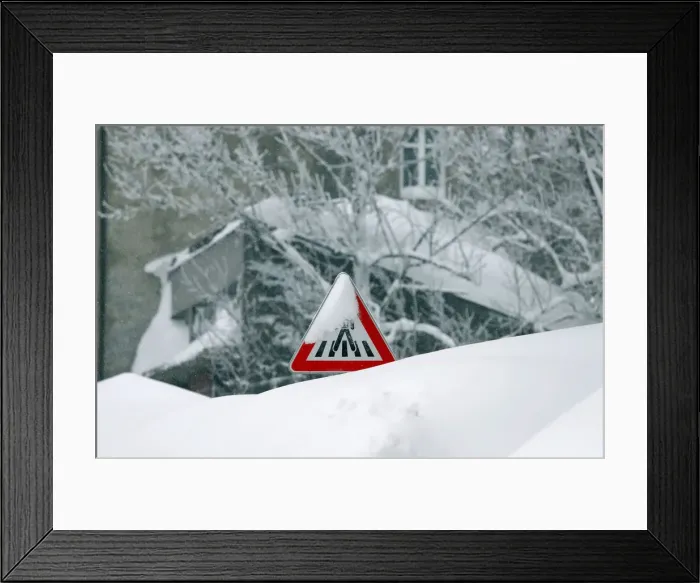 Framed Print : A road sign covered with snow is seen in Delnice Framed Print : A road sign covered with snow is seen in Delnice
