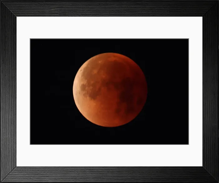Framed Print : A lunar eclipse of a full Blue Moon is seen in Santa Monica Framed Print : A lunar eclipse of a full Blue Moon is seen in Santa Monica